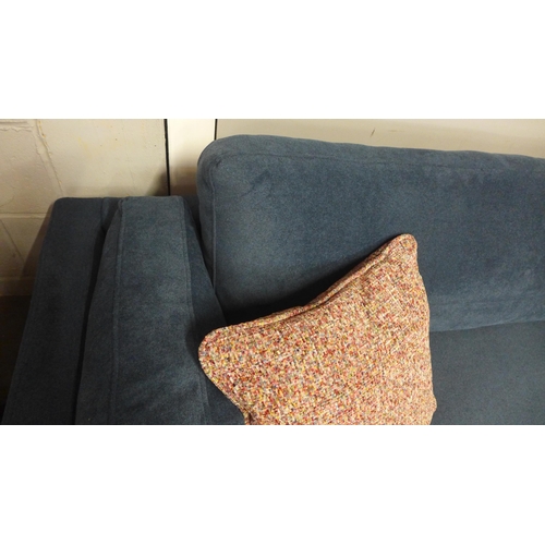 1440 - A navy blue velvet 4.5 seater sofa with black oak feet