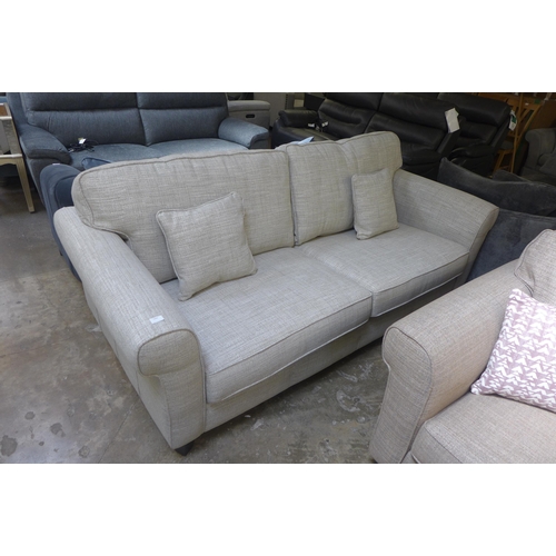 1446 - An oatmeal textured weave upholstered 3.5 seater sofa