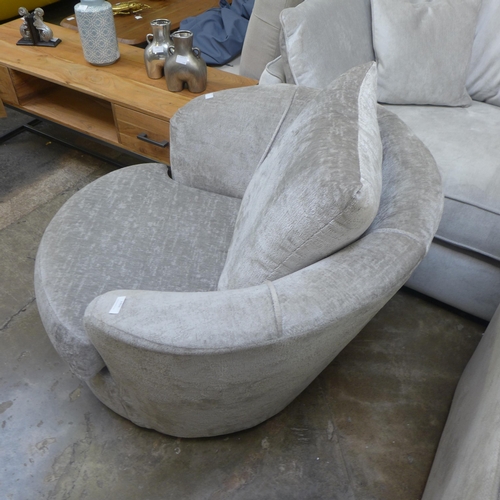 1451 - A silver velvet swivel armchair