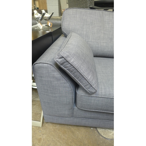 1488 - A static grey upholstered three seater sofa