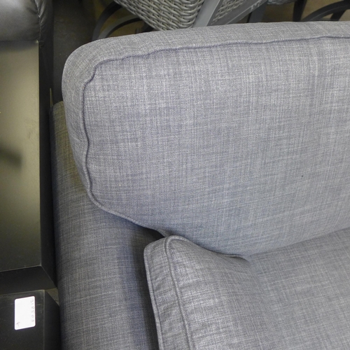 1488 - A static grey upholstered three seater sofa