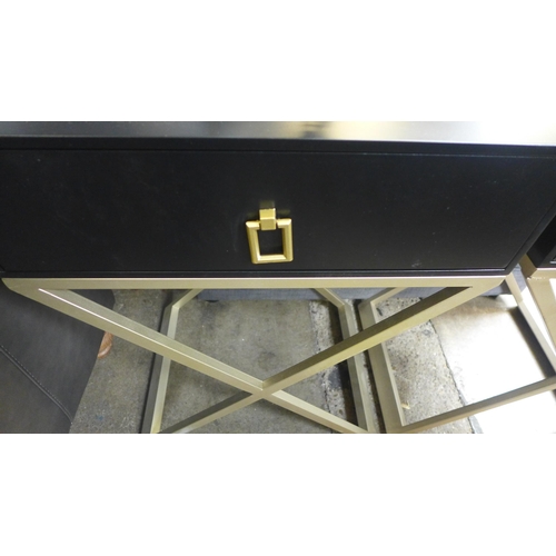 1489 - A pair of black bedside tables with cross legs