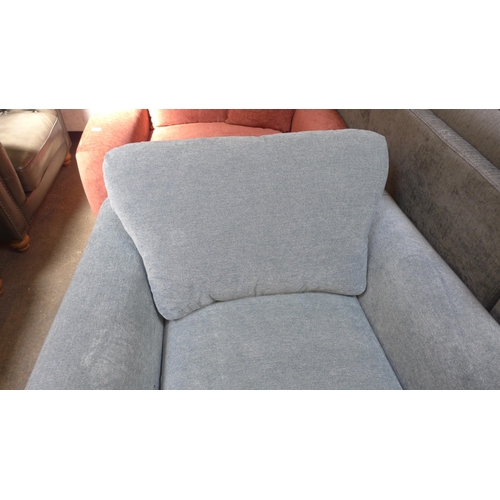 1495 - A light blue fleck velvet upholstered armchair on turned oak legs