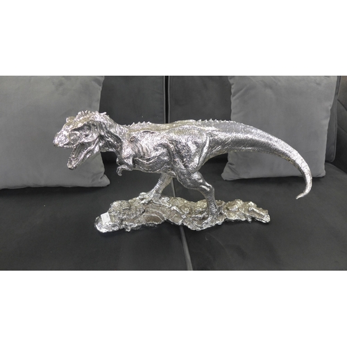 1498 - A silver T-Rex sculpture