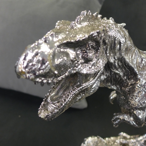 1498 - A silver T-Rex sculpture