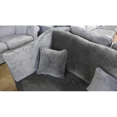 1502 - A Halley magnesium upholstered four seater sofa