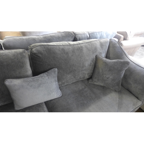 1502 - A Halley magnesium upholstered four seater sofa