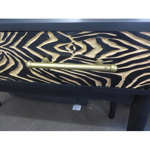 1510 - A console table with zebra design - damaged leg