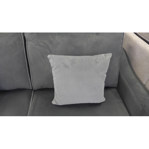 1514 - A mid grey velvet upholstered small three seater sofa with light grey piping and scatter cushions on... 