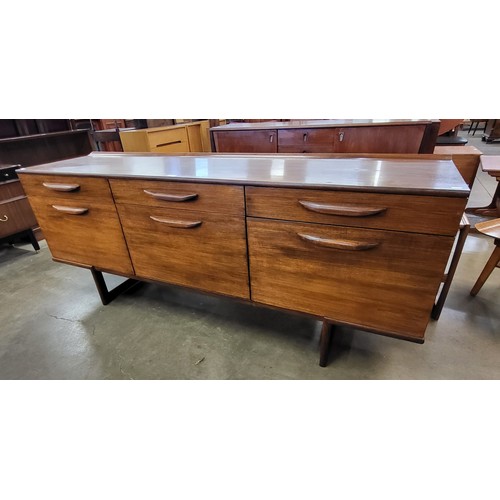 24 - A teak sideboard