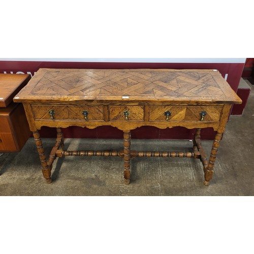 98 - A Queen Anne style oak parquetry top three drawer dresser