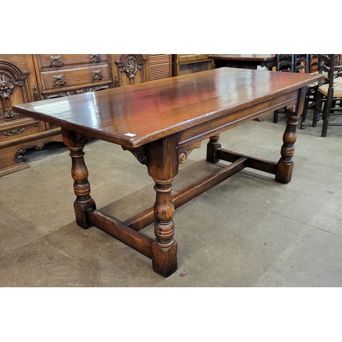 100 - A 17th Century style Ipswich oak refectory table, 75cms h, 183cmsnl, 82cms w