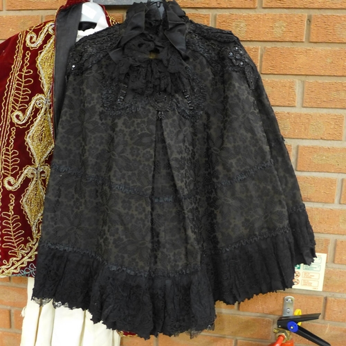 1084 - A Victorian black cape and a red velvet and gold and silver thread jacket, etc. **PLEASE NOTE THIS L... 