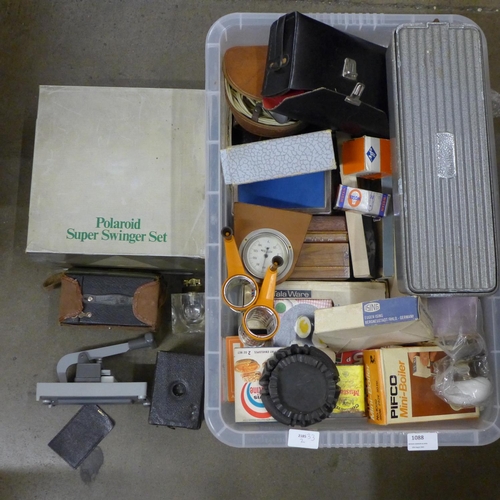 1088 - A box of assorted items, blood pressure kit, Polaroid camera, boxed, table lighter, etc. **PLEASE NO... 