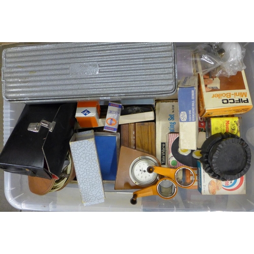 1088 - A box of assorted items, blood pressure kit, Polaroid camera, boxed, table lighter, etc. **PLEASE NO... 