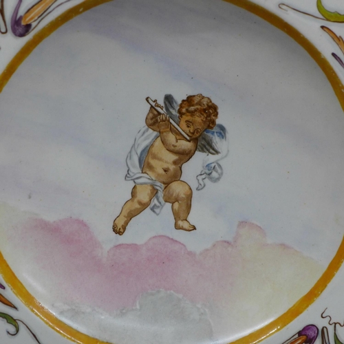 608 - A 19th Century dish decorated with cherubs, 32.5cm