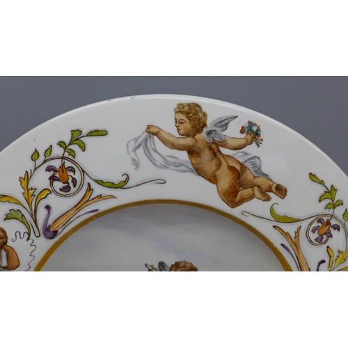 608 - A 19th Century dish decorated with cherubs, 32.5cm