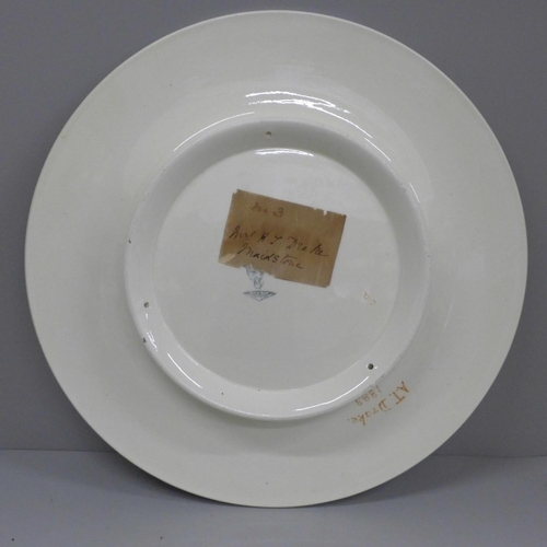 608 - A 19th Century dish decorated with cherubs, 32.5cm