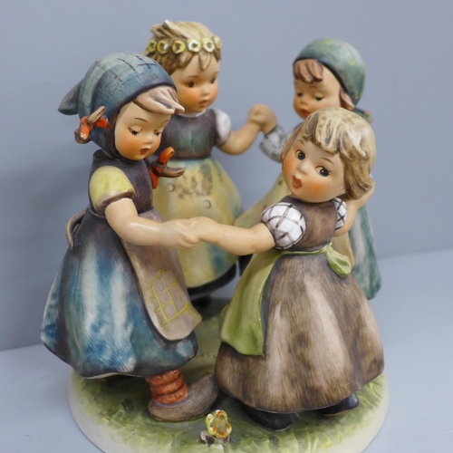 609 - A Hummel figure group, Ring around the Rosie, dated 1957 to the base