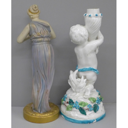 614 - A Royal Worcester figure, 1828 mark to base, a/f and a porcelain cherub candlestick