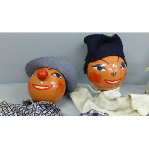 616 - Two 1950's glove puppets, three Swedish wooden dolls, one other peg doll and two egg cups