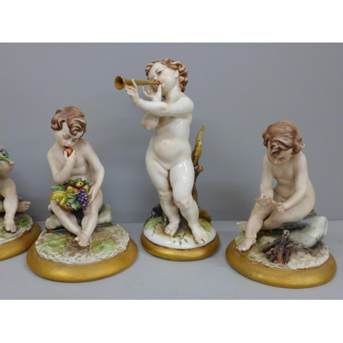 621 - Three matching Neapolitan figures of putti and two others