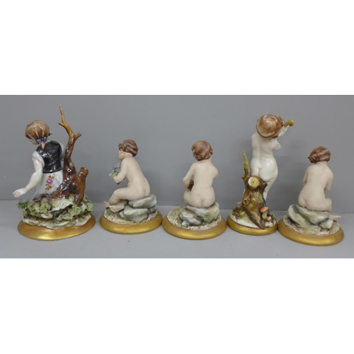 621 - Three matching Neapolitan figures of putti and two others