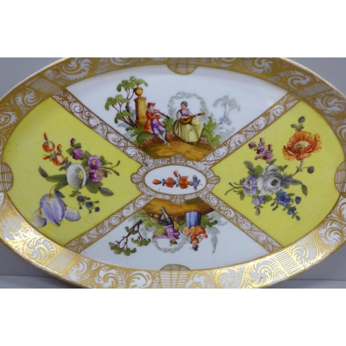 622 - A Meissen oval dish decorated with musicians, a courting couple and bouquets of flowers, 30.5cm