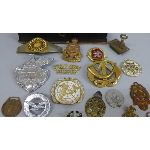 626 - A collection of military badges and a Pacific Star medal