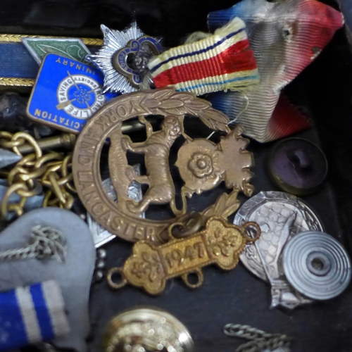 626 - A collection of military badges and a Pacific Star medal