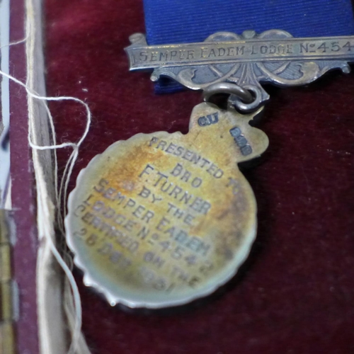 632 - Two Festival of Britain 1951 crowns, two World Cup keyrings, regalia and a silver lodge medal, cased