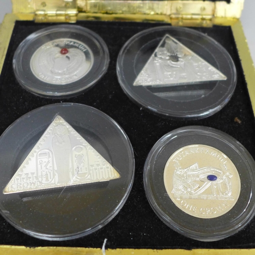 648 - A pyramid box with four silver proof Isle of Man 2008 Tutankhamun coins, each 28g