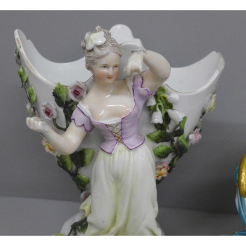 650 - A German porcelain figural spill holder and egg ornament, both a/f