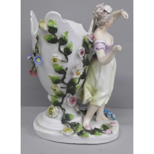 650 - A German porcelain figural spill holder and egg ornament, both a/f