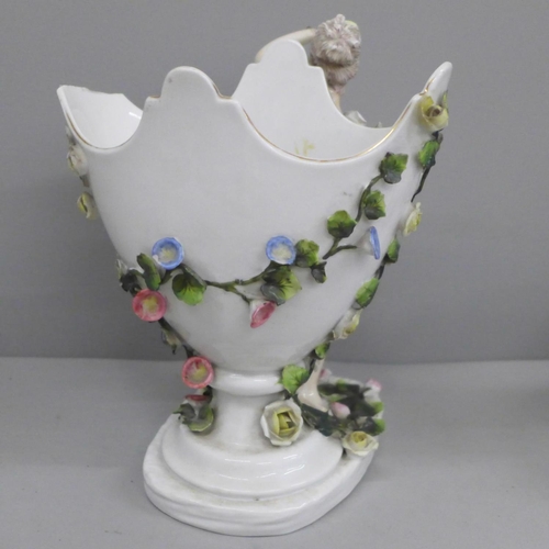 650 - A German porcelain figural spill holder and egg ornament, both a/f