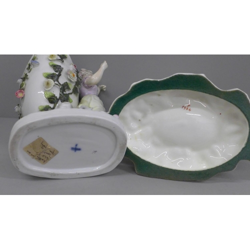 650 - A German porcelain figural spill holder and egg ornament, both a/f