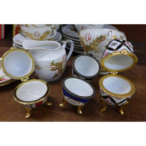 660 - A Japanese tea set, three egg trinket pots, two Old Country Roses dishes and a model of a giraffe