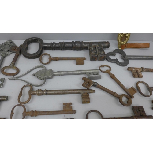 692 - A large collection of antique and replica door and lift keys