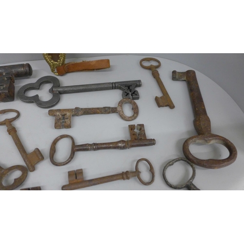 692 - A large collection of antique and replica door and lift keys