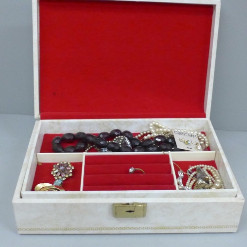 694 - A jewellery box with contents