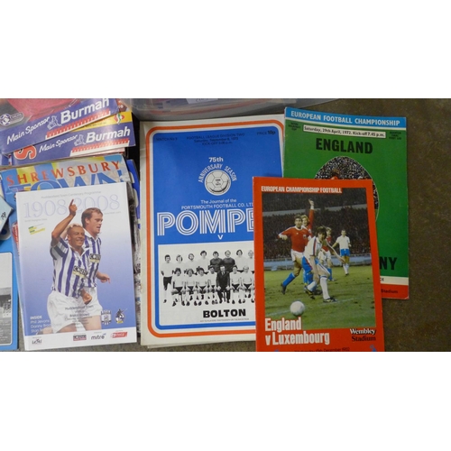 704 - Sporting memorabilia; a large box of football annuals and programmes including England international... 