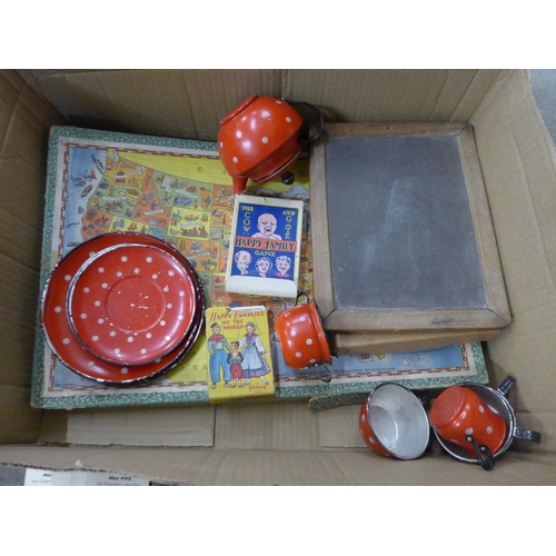 706 - A collection of 1950's toys, includes a child's polka dot tea set, chalk board, Happy Families playi... 