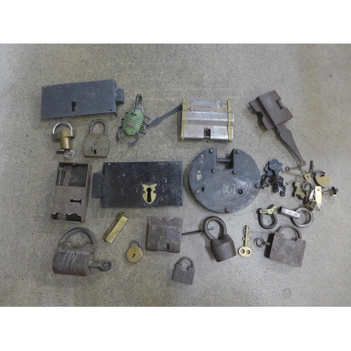 710 - A collection of locks including Indian, Tibetan, three puzzle locks, etc.