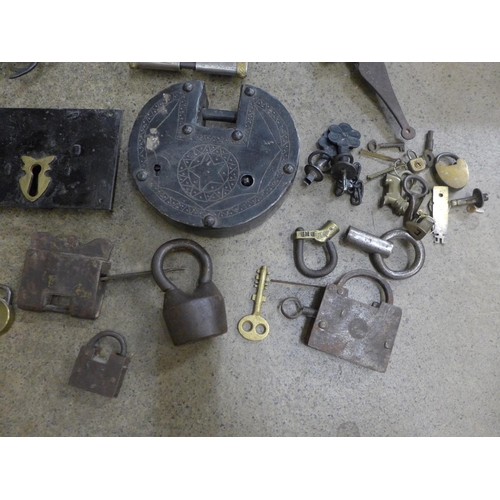 710 - A collection of locks including Indian, Tibetan, three puzzle locks, etc.