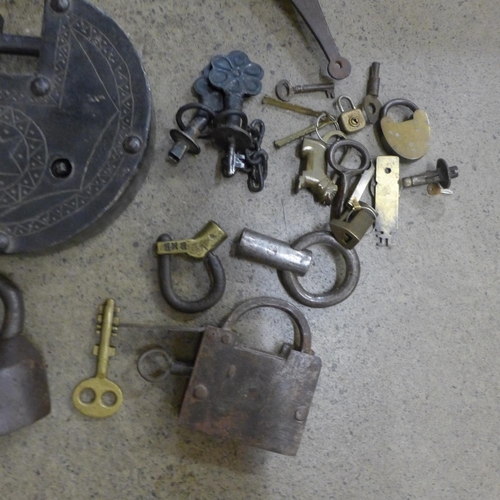 710 - A collection of locks including Indian, Tibetan, three puzzle locks, etc.