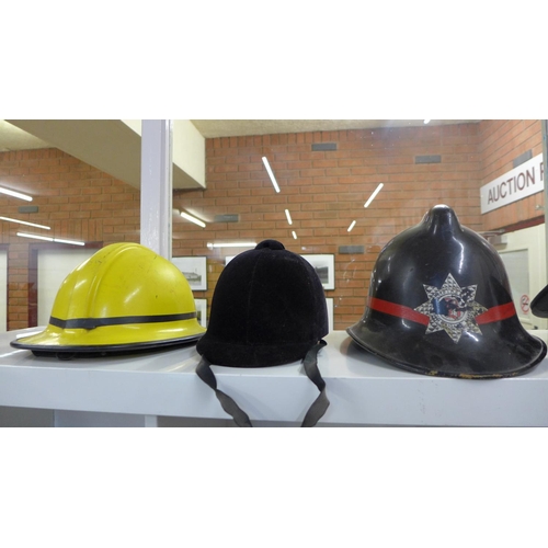 732 - Two Fire Service helmets, three peaked caps and a horse riding helmet