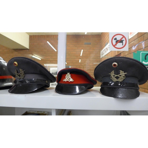 732 - Two Fire Service helmets, three peaked caps and a horse riding helmet