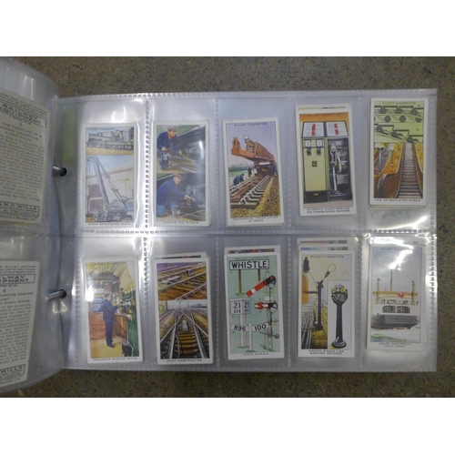 733 - Cigarette cards; an album of ten complete sets of cigarette cards including Wills British Butterflie... 