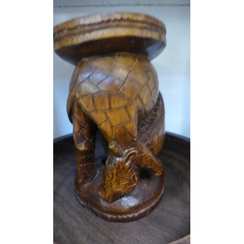 746 - An African tribal carved wooden bowl with utensils and a stand/stool in giraffe form