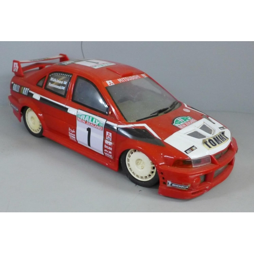 755 - A remote control rally car, no remote controller and three other model cars